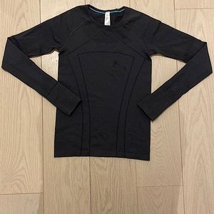 black long sleeve Ivviva shirt.